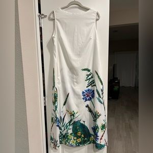 White Maxi dress with floral design at bottom of dress